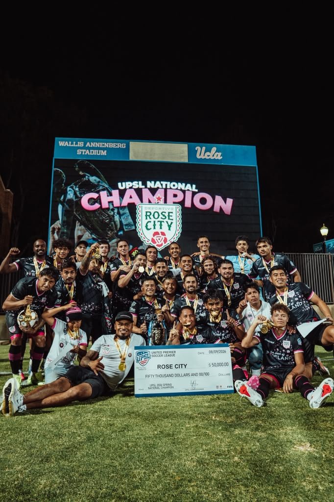 The national champion squad in front of the UPSL champions screen