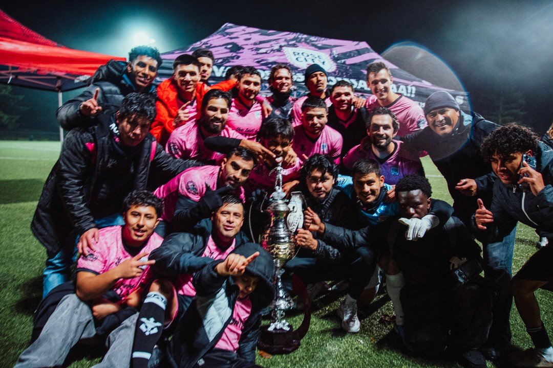 Rose City Deportivo celebrating with the trophy